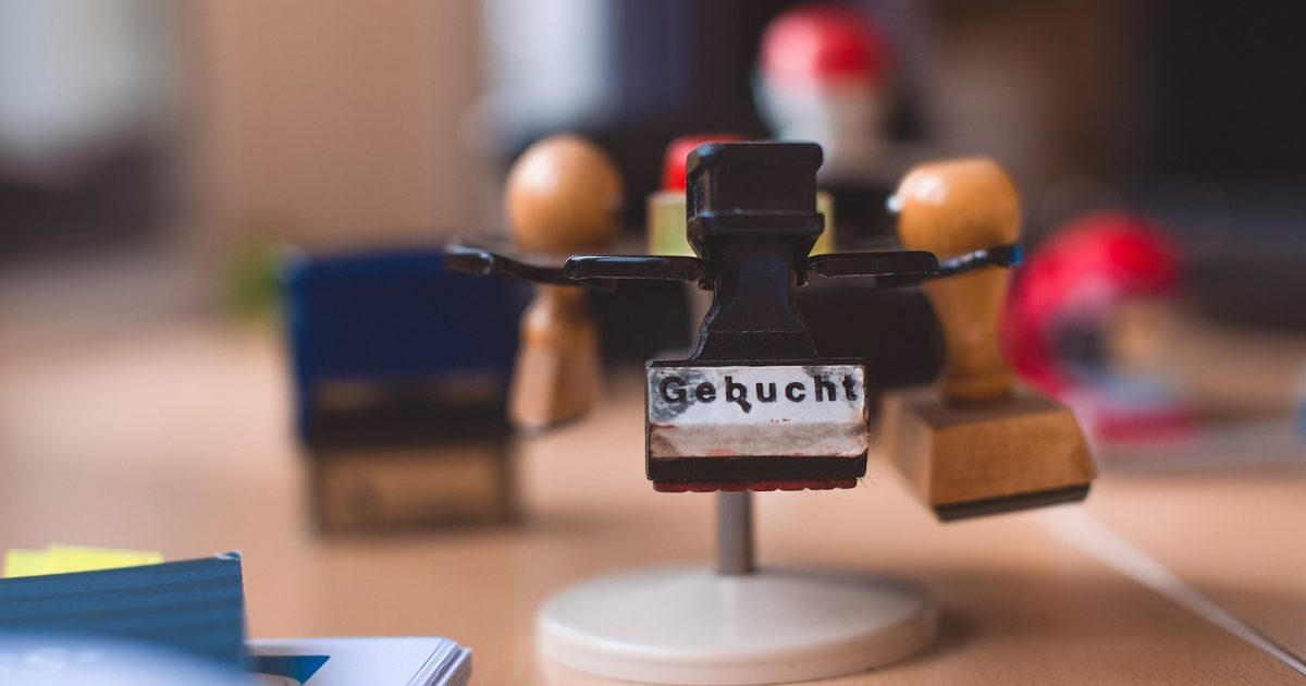 Carousel of rubber stamps on a wooden office desk